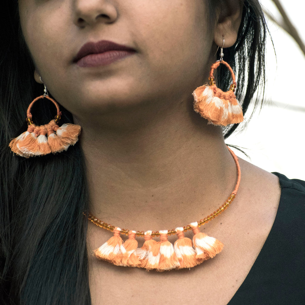Handmade wire choker and earrings embellished with orange ikat tassels and beads