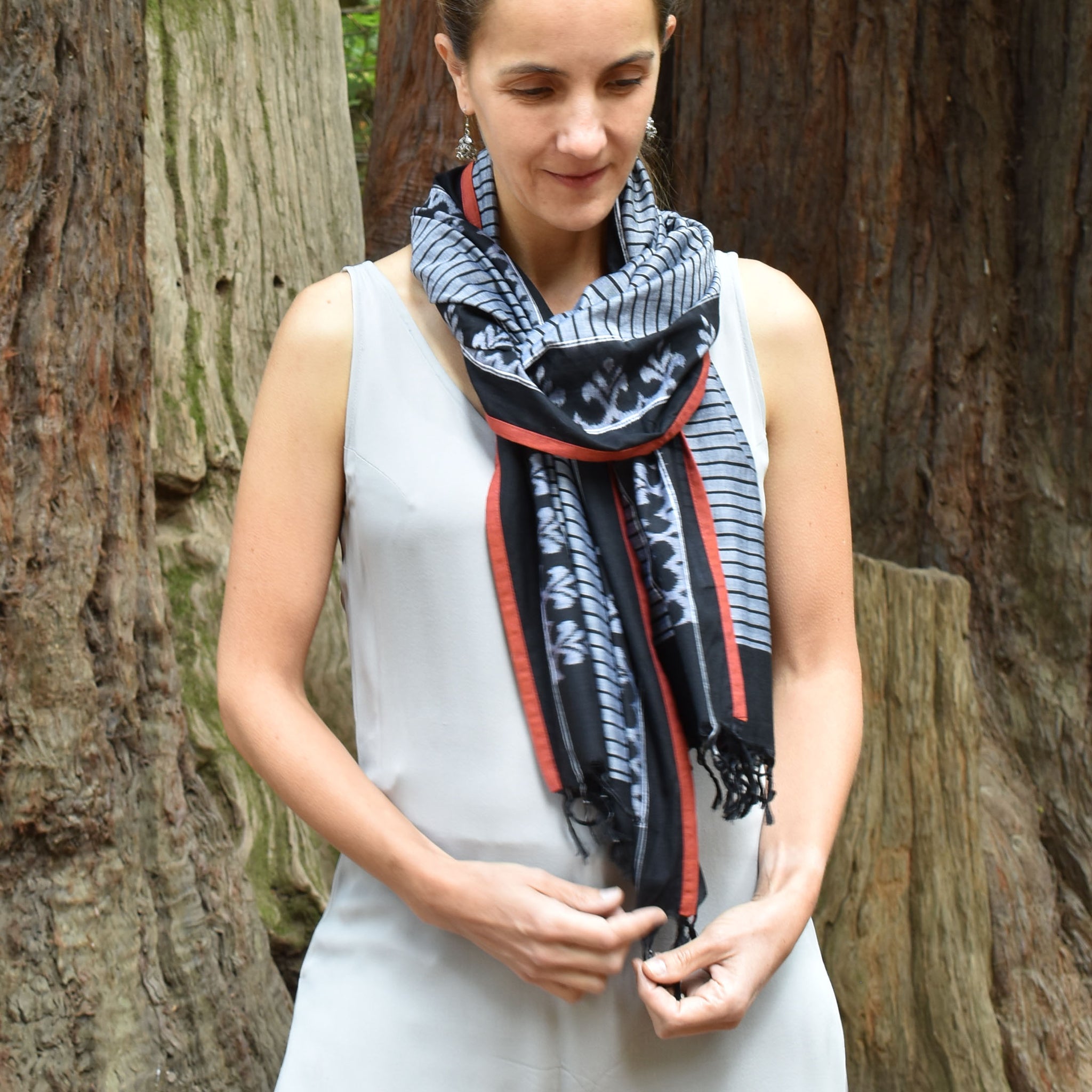 Traditional ikat stole with black fera stripes on grey cotton base and contrast orange edge piping