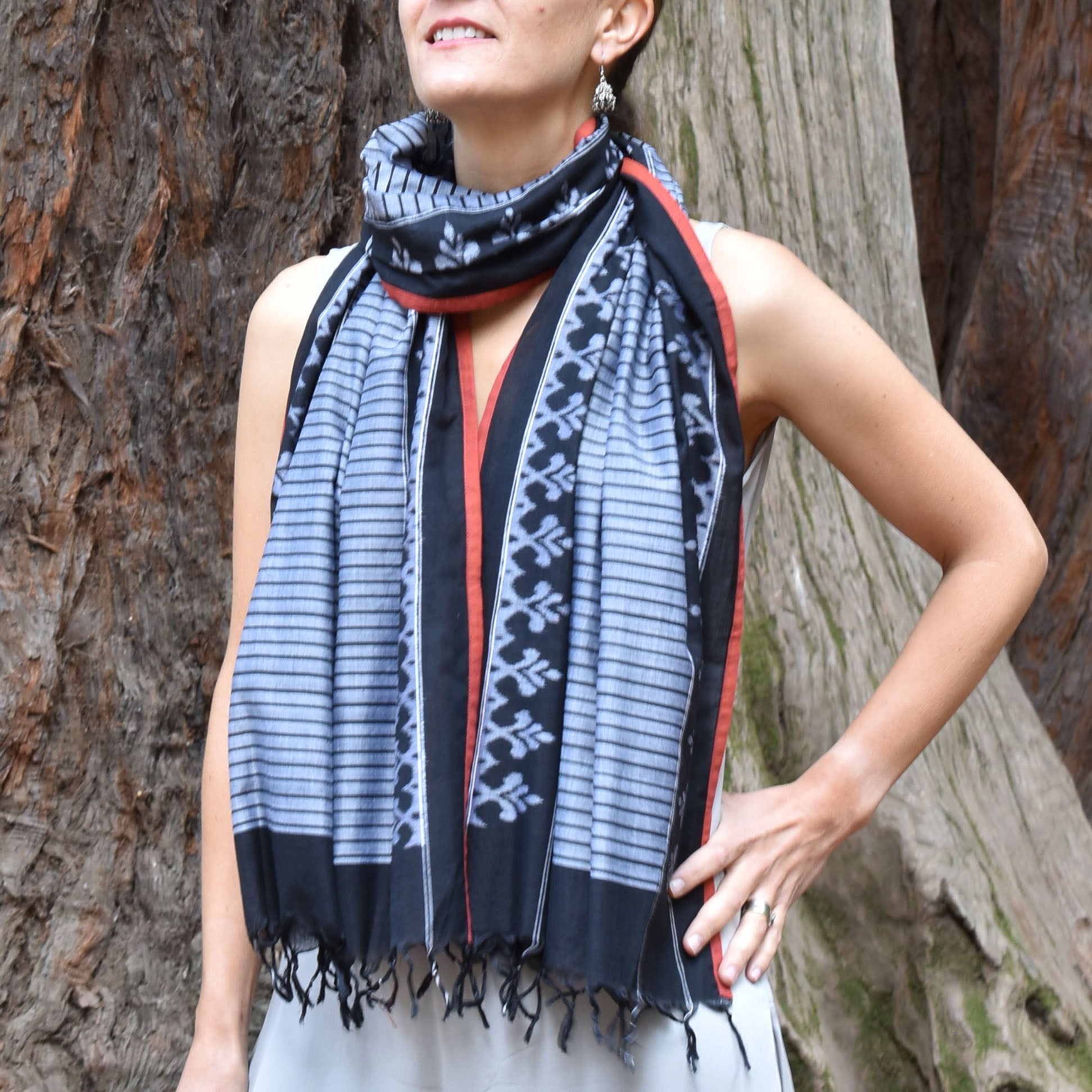 Traditional ikat stole with black fera stripes on grey cotton base and contrast orange edge piping