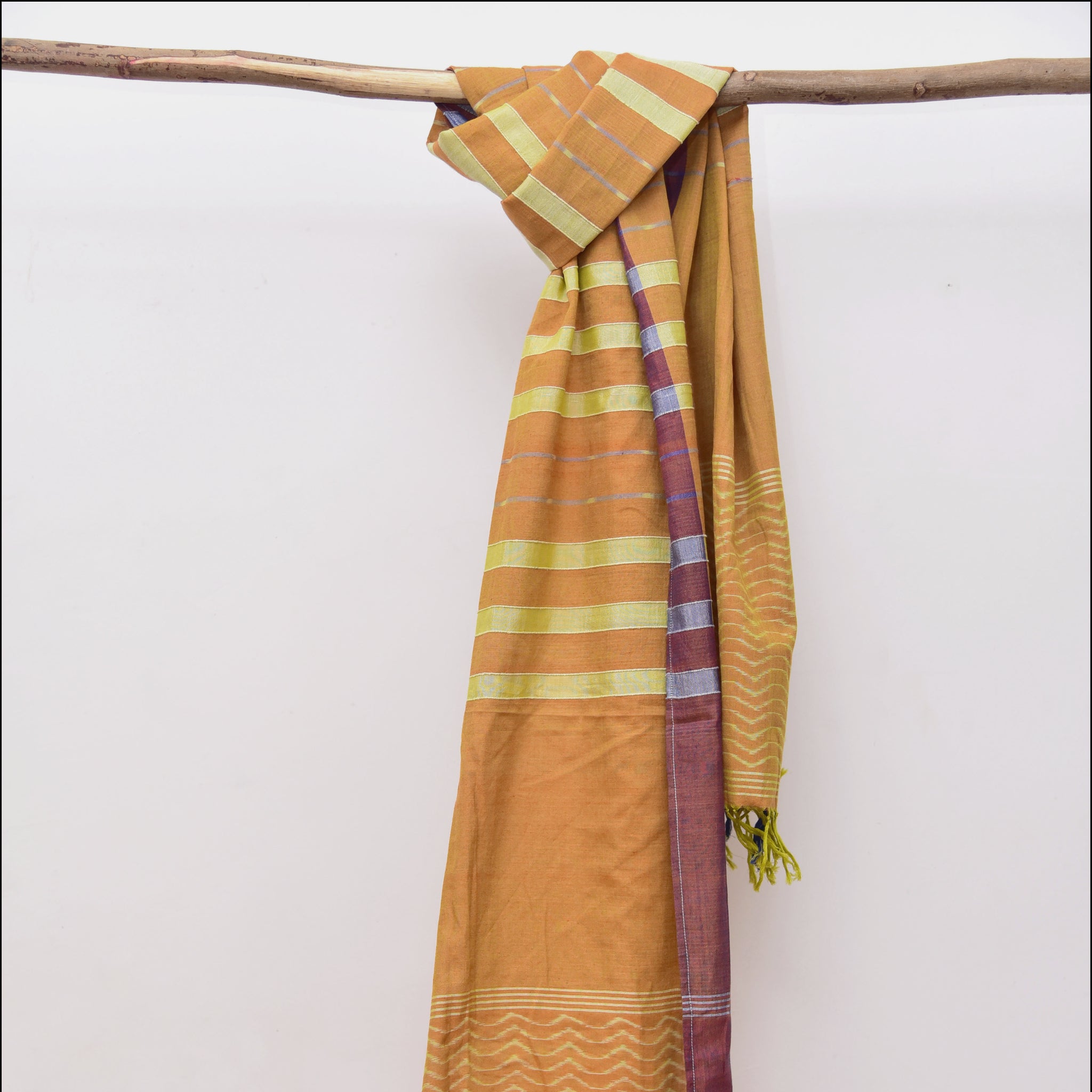 Sambalpuri orange cotton ikat stole with wave motifs on both ends.