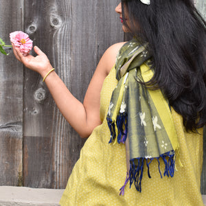 Shimmery green Sambalpuri cotton ikat scarf with allover butterfly motifs.