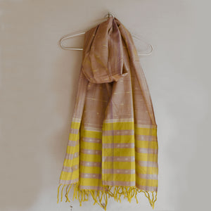 Shimmery green cotton ikat scarf with allover ikat dots and tassles at ends.