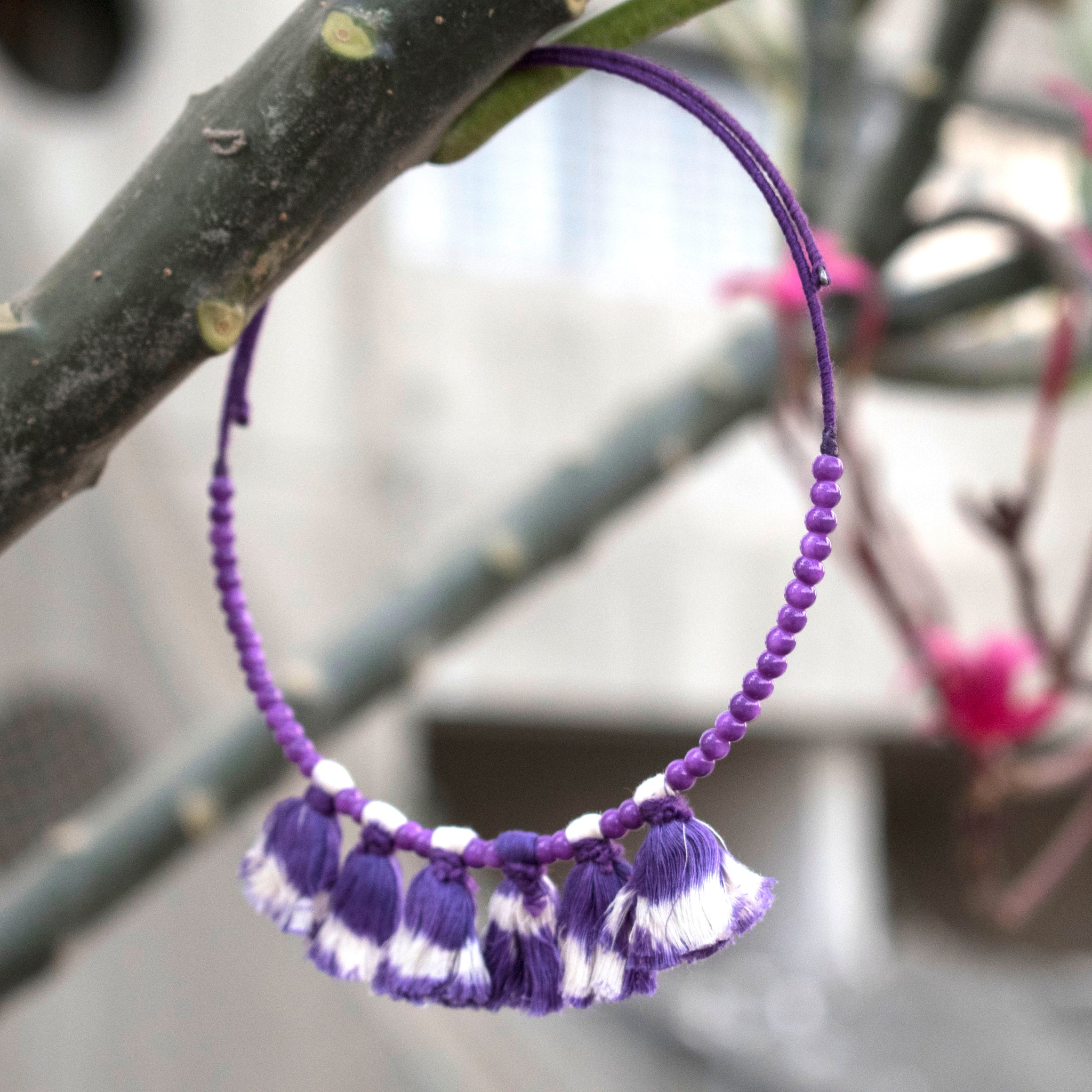 Wire choker embellished with purple ikat tassels and beads
