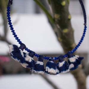 Wire choker embellished with navy blue ikat tassels and glass beads
