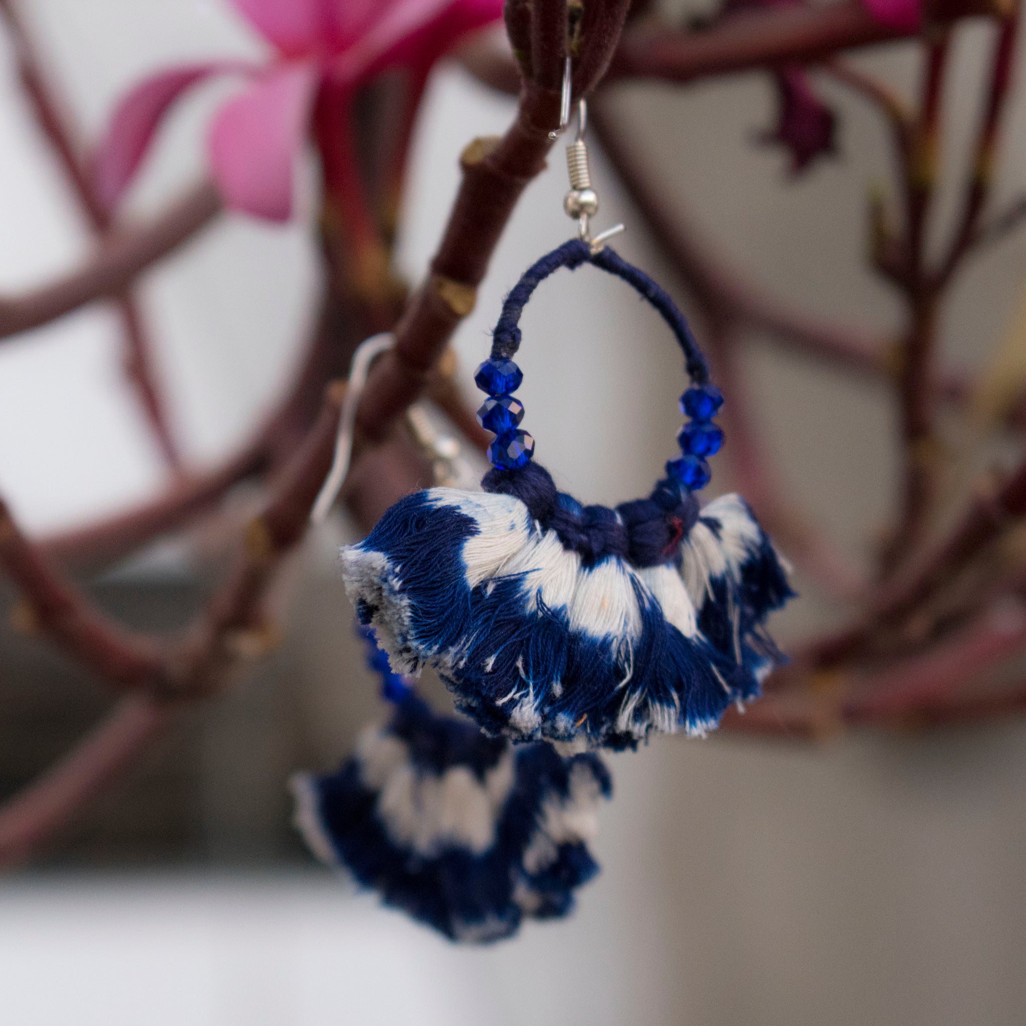 Earring embellished with navy blue ikat tassels