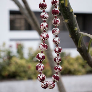 Handcrafted maroon ikat beaded necklace