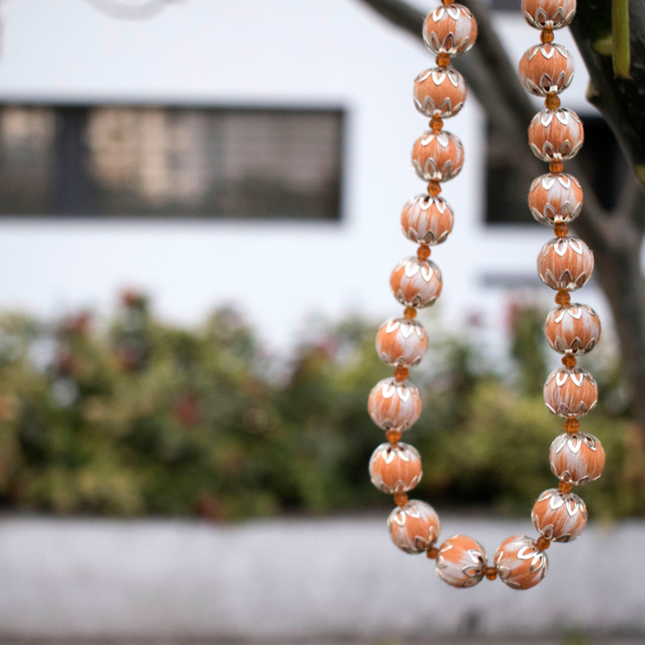 Handcrafted orange ikat beaded necklace
