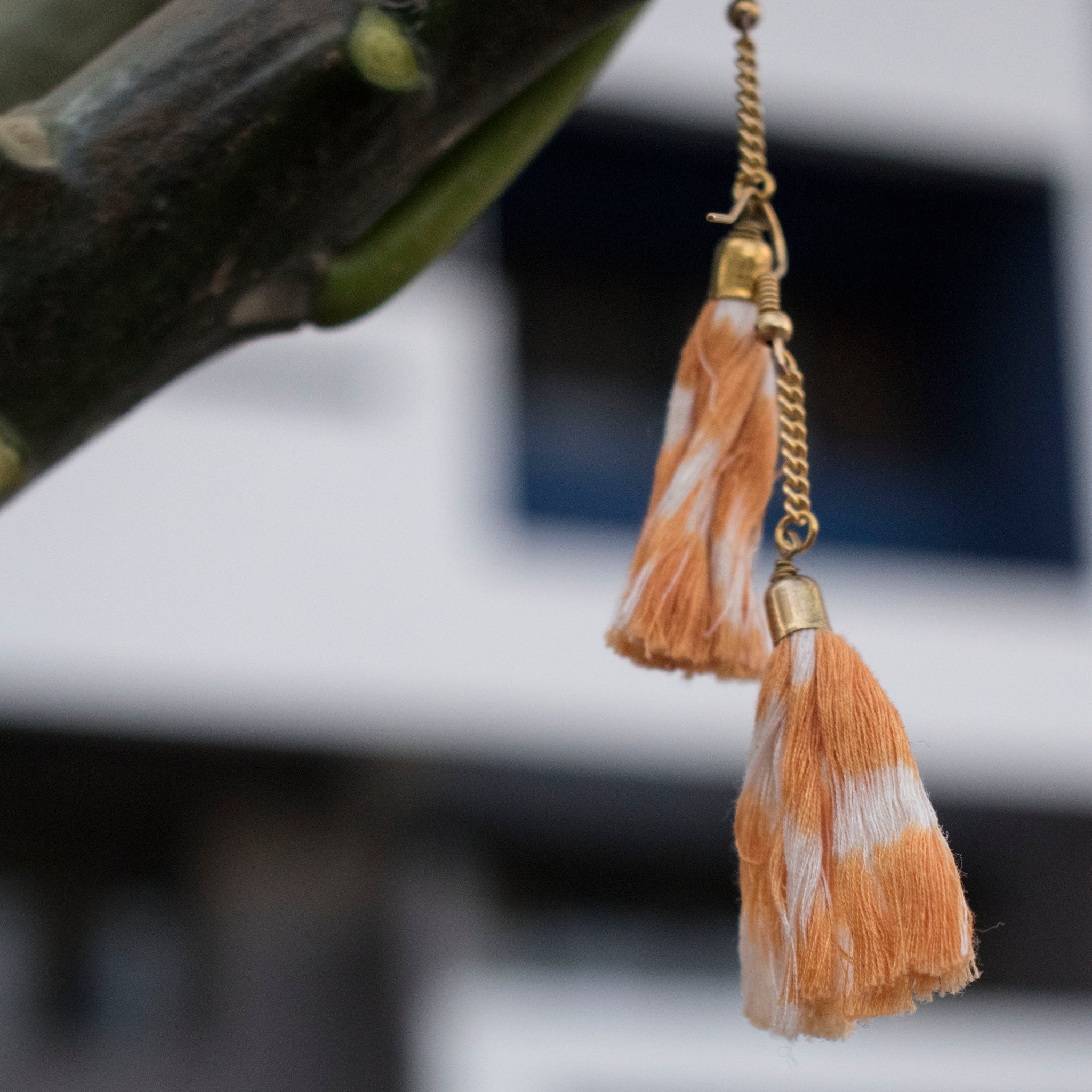 Handcrafted orange ikat tassel earrings