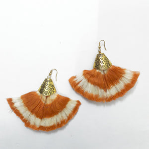 Handcrafted Bohemian style orange ikat tassel earrings with metal clasp