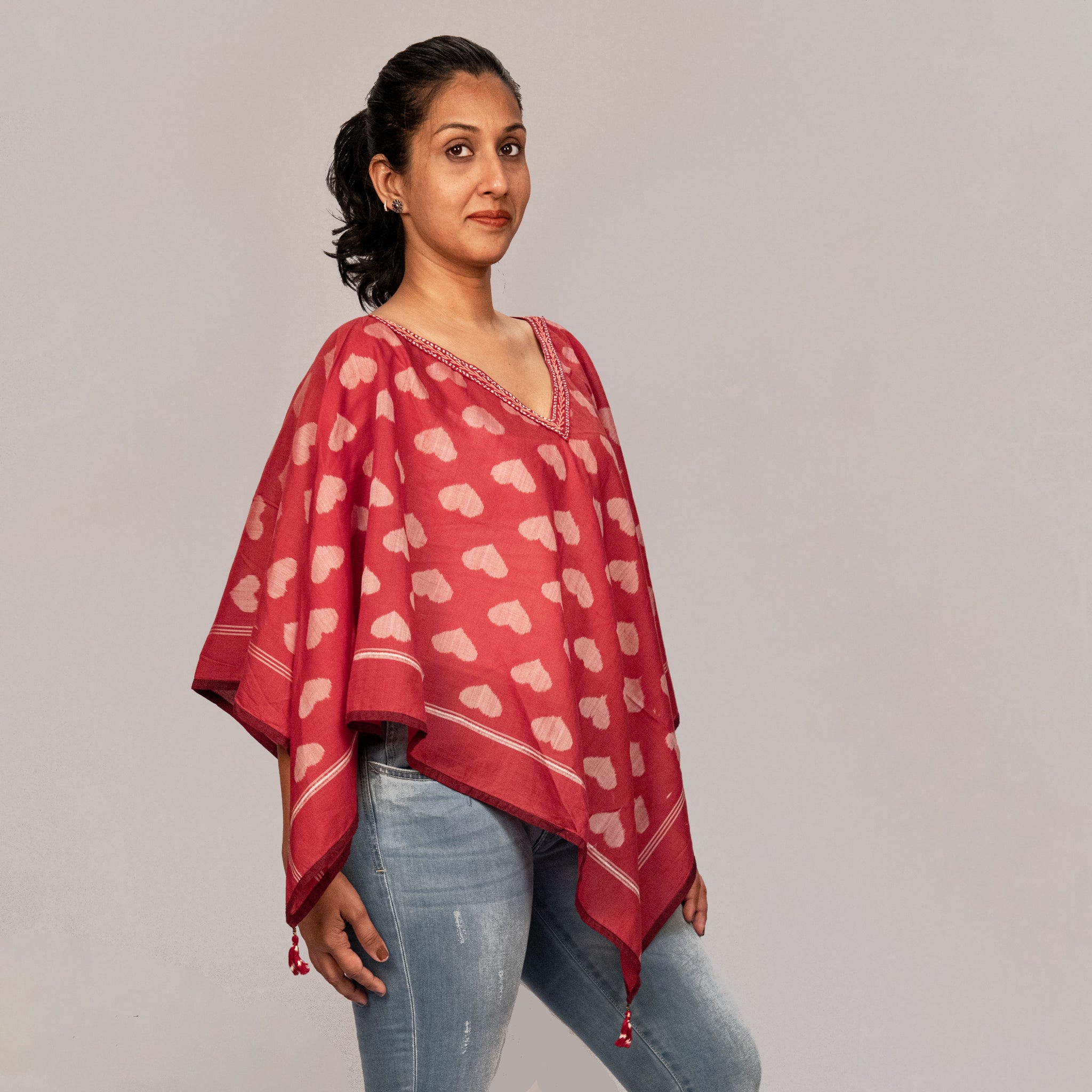 Sambalpuri triangle maroon ikat poncho with allover taash hearts and hand embroidery detailing on neck