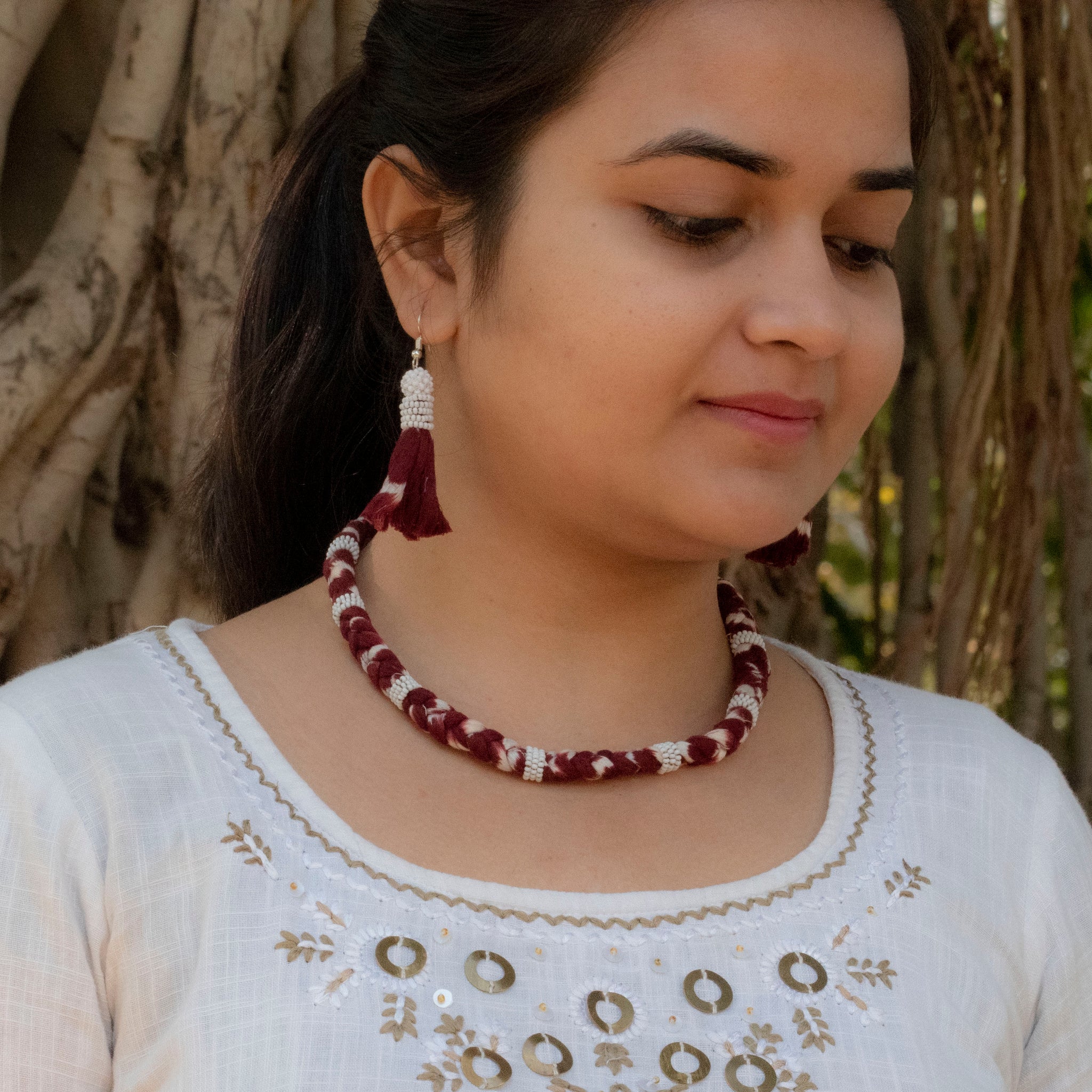 Handmade jewellery set of Maharani cotton ikat necklace with metallic chain adjuster and tassel earrings