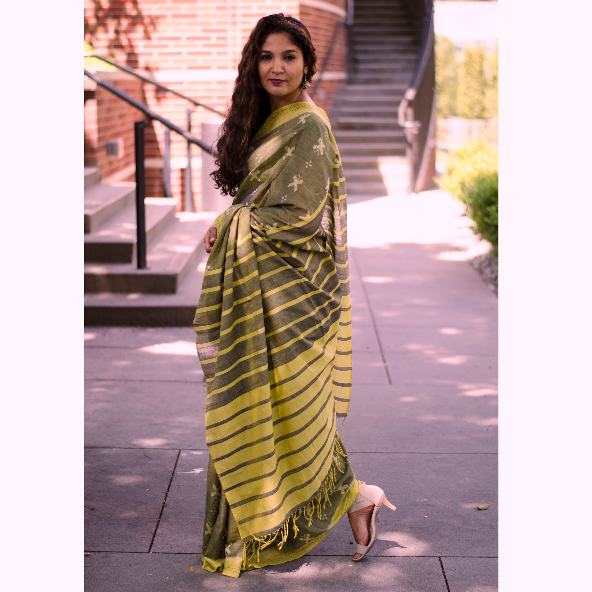 Pallu of two tone olive green Sambalpuri cotton ikat saree with all over butterfly motifs.